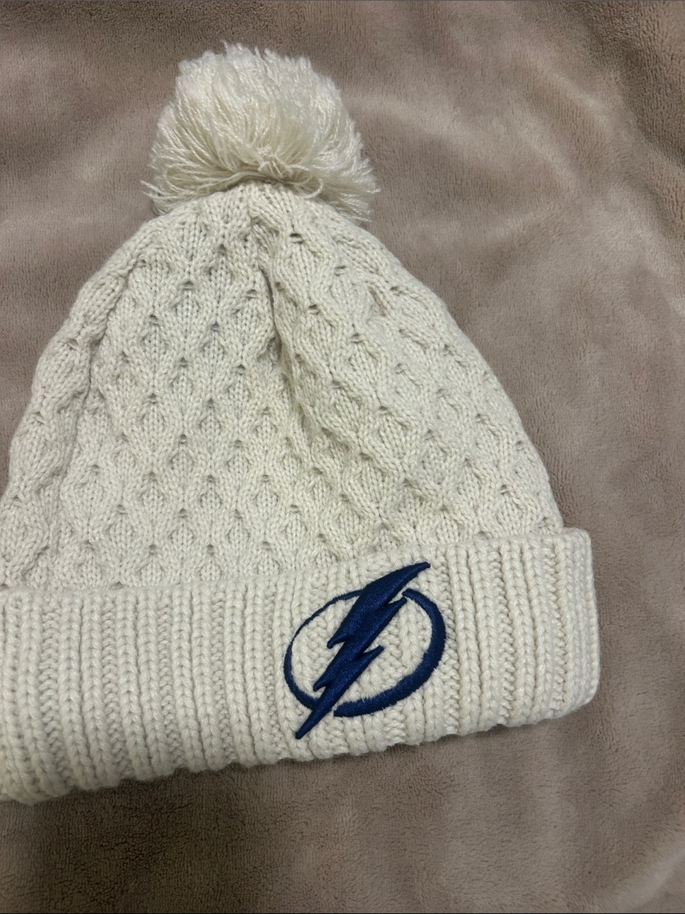 New Era Cream Knit Pom Beanie with Blue Lightning Logo